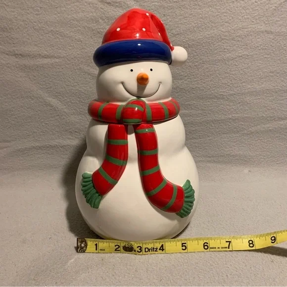 Holiday Snowman Cookie Jar with Santa’s red hat and red/green striped scarf. - Picture 3 of 8